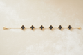 Black Onyx Four-Leaf Clover Charm Bracelet | Gold-Tone Stainless Steel