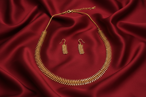 Antique Gold Fishbone Necklace Set on Red Silk