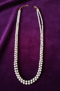 Double Strand Pearl Necklace on Royal Purple Velvet