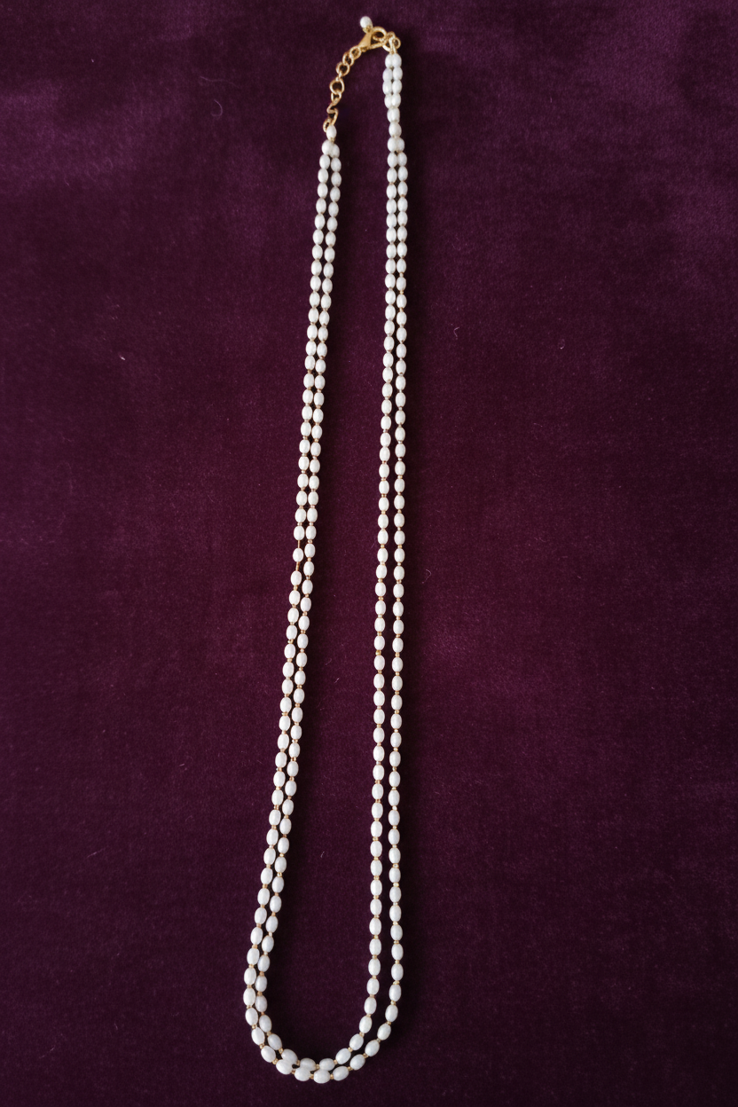 Double Strand Rice Pearl Necklace on Royal Purple Velvet