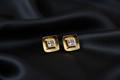 Gold Diamond CZ Stud Earrings on Black Silk