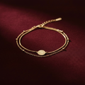 Gold Layered Coin Bracelet on Burgundy Velvet