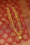 Gold Temple Jewellery Haar on Red Banarasi Silk - Corrected
