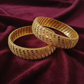 Gold-Tone Diamond Lattice Mesh Bangle Set on Dark Maroon Velvet