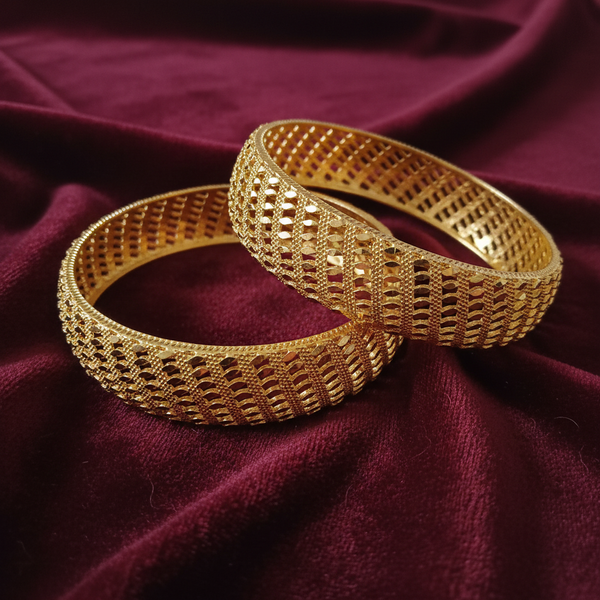 Gold-Tone Diamond Lattice Mesh Bangle Set on Dark Maroon Velvet