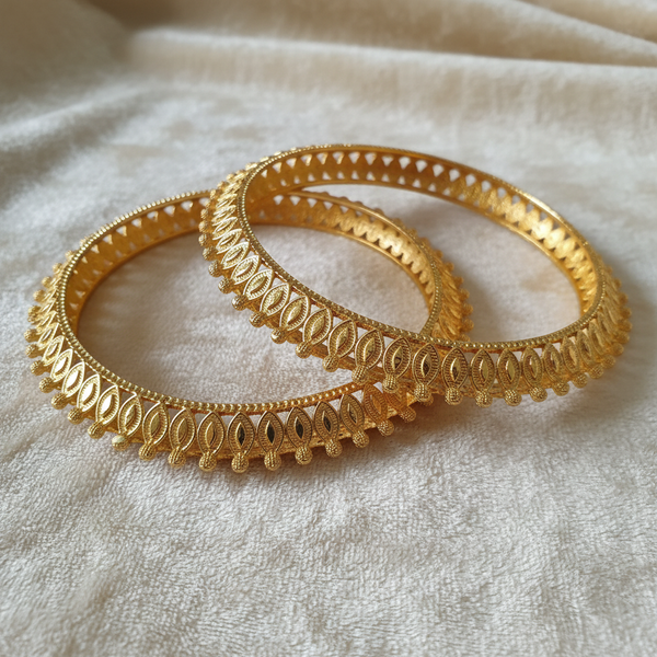 Gold-Tone Leaf Jali Bangle Set on Ivory Velvet