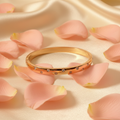 Rose Gold Crystal Bezel Bangle on Rose Petal Background