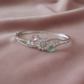 Silver-Tone Pastel Floral Bangle on Dusty Rose Velvet